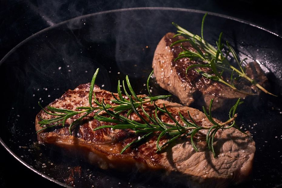 two steaks in a pan