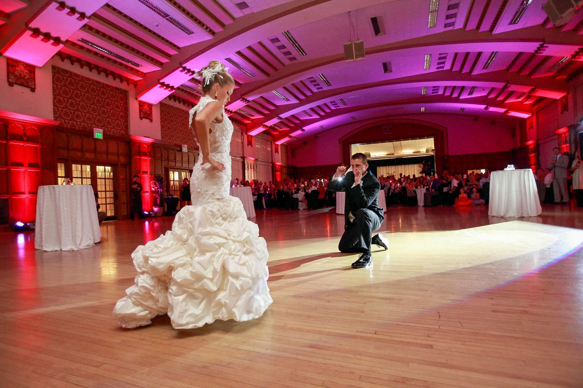 The bride and groom perform a custom dance routine at their wedding.