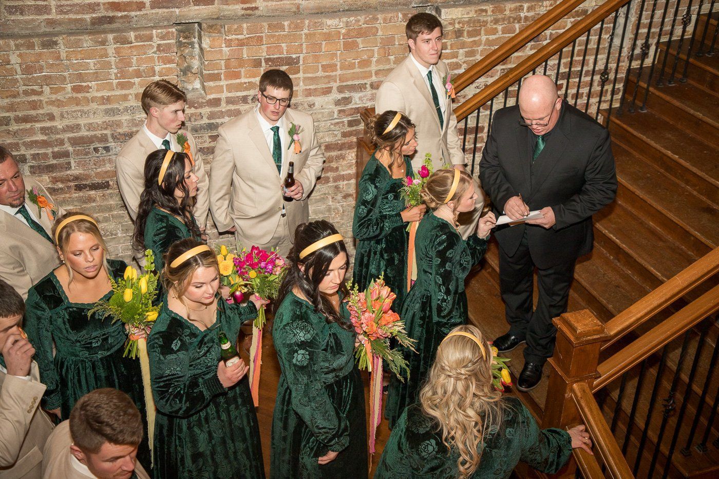 Indianapolis wedding DJ Aaron Bracken preps the wedding party to enter the reception.