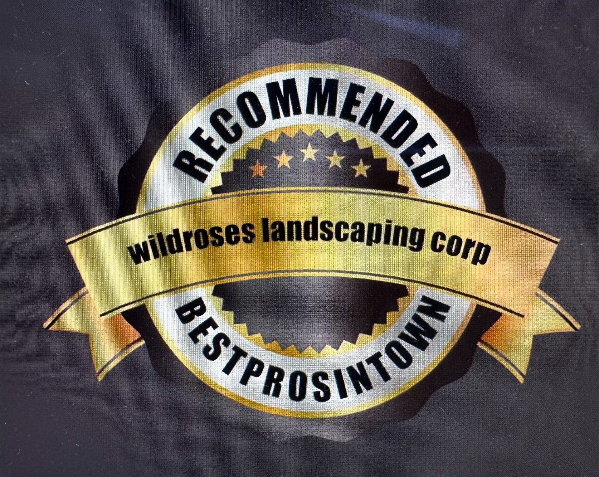 Recommended Wildrose Landscaping Corp logo badge with gold ribbon and “Best Pros in Town” text