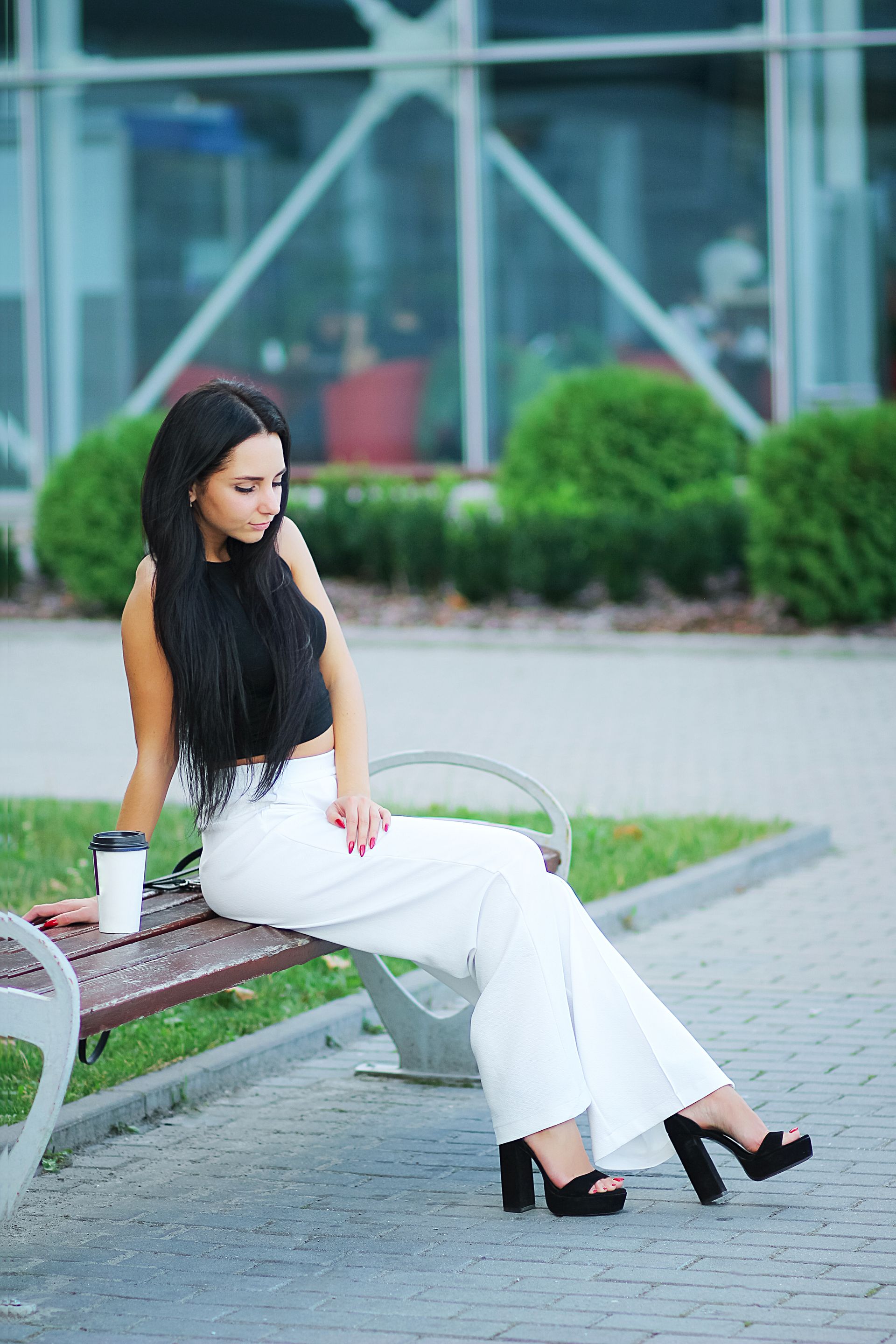 woman sitting in front of building