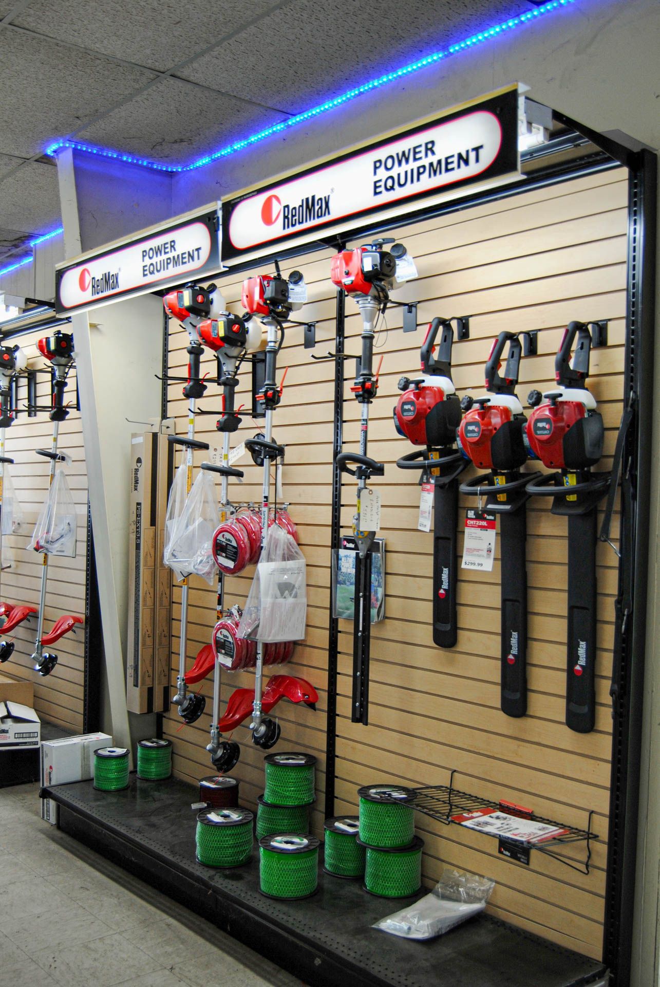 A display of lawn mower equipment in a store