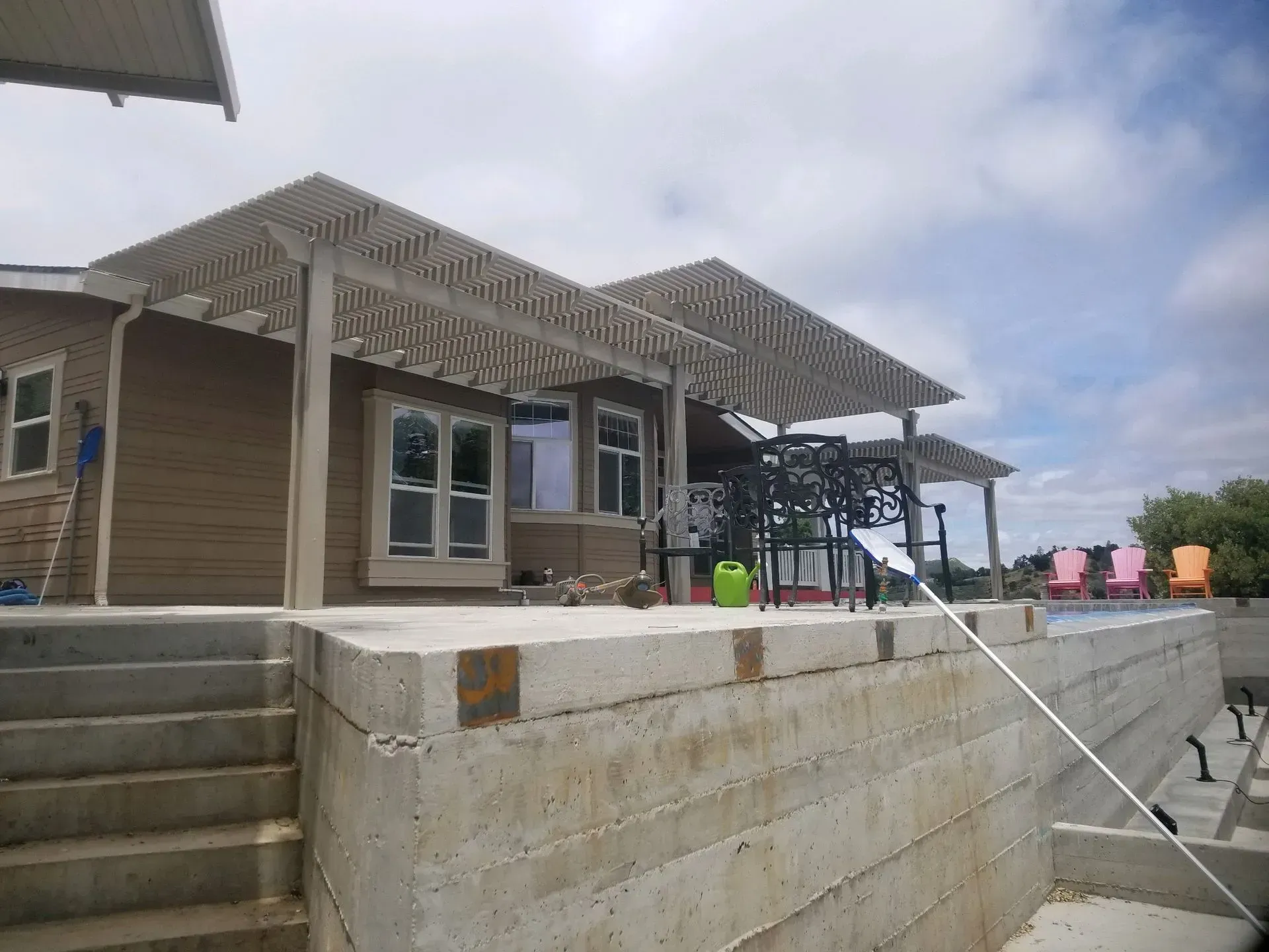 A house with a patio area and stairs leading up to it