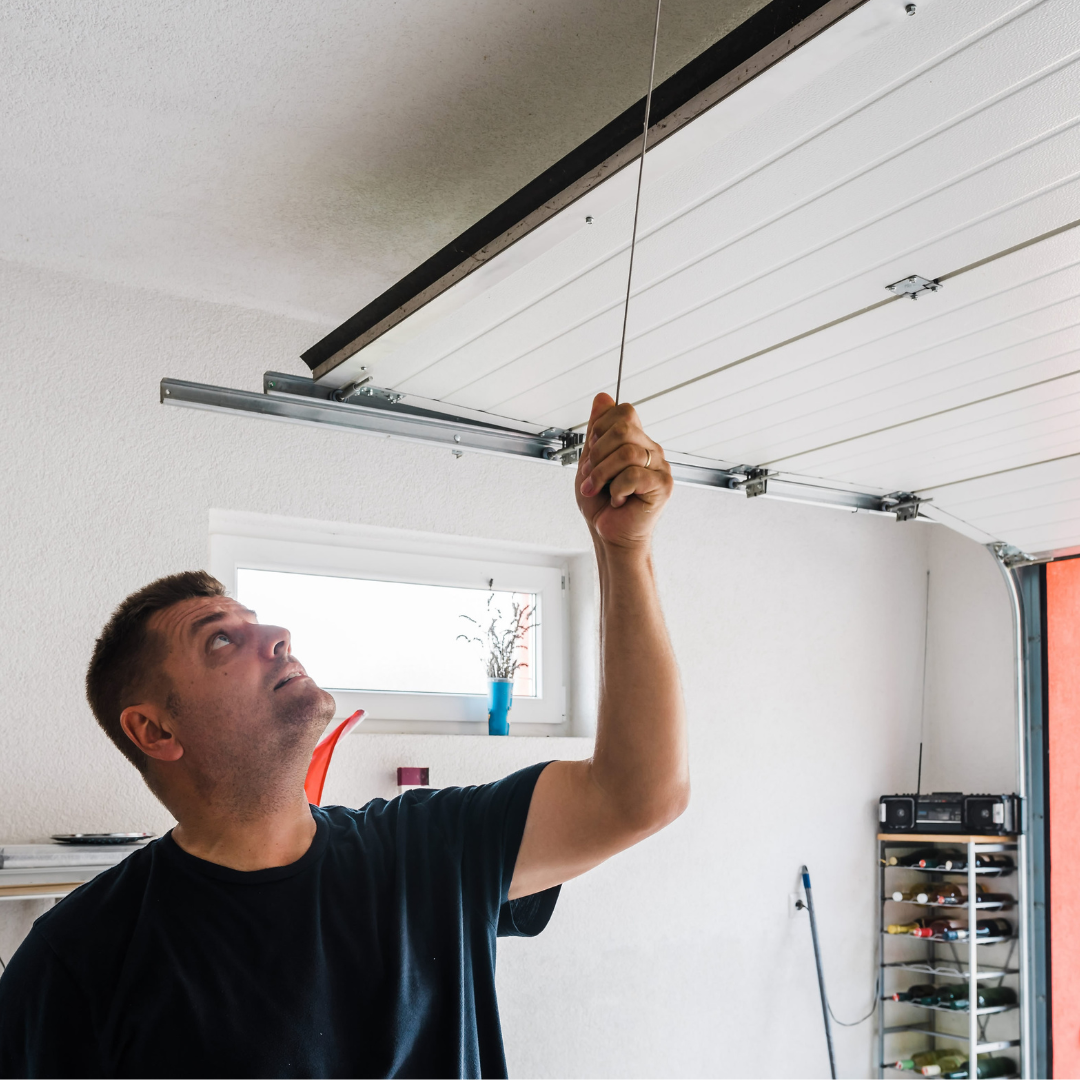 Man fixing his own garage door
