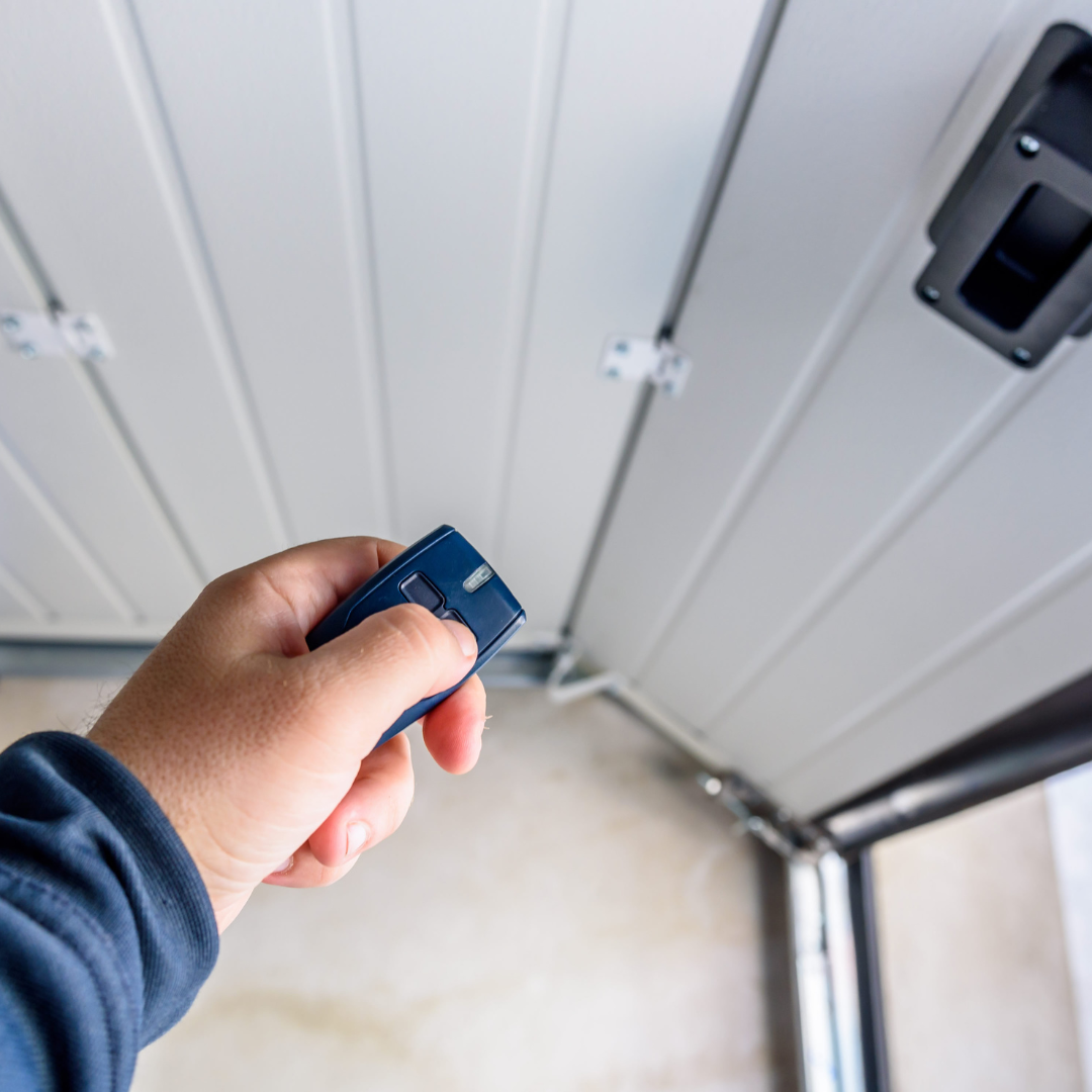 Garage door repair man testing remote