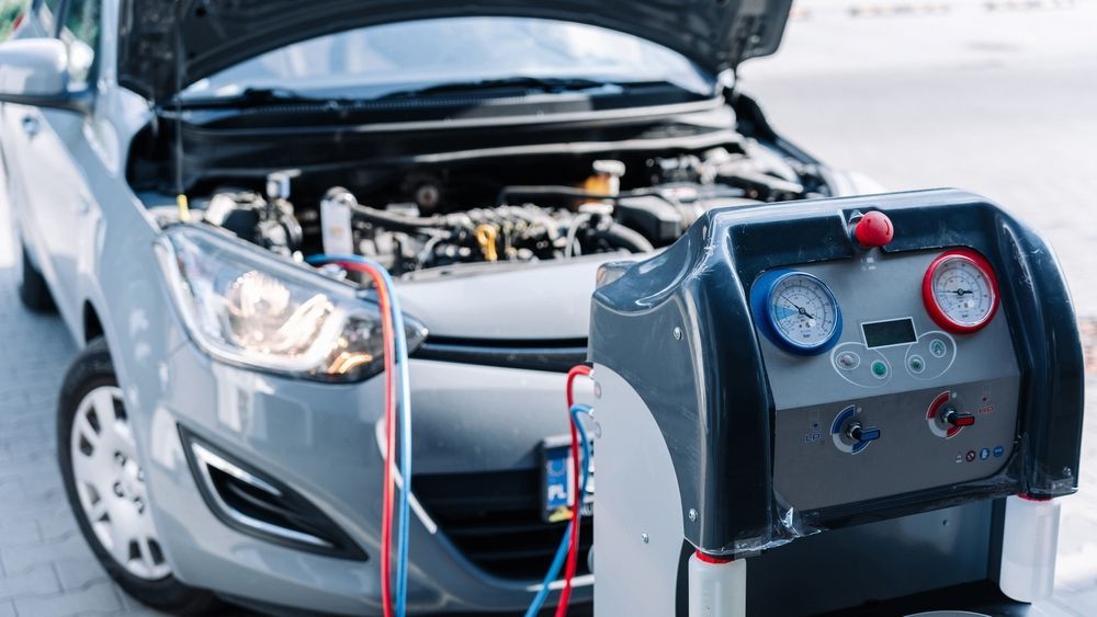 A Car With The Hood Up Is Being Serviced By A Mechanic — Gillies Enterprises Pty Ltd In Coonamble, NSW
