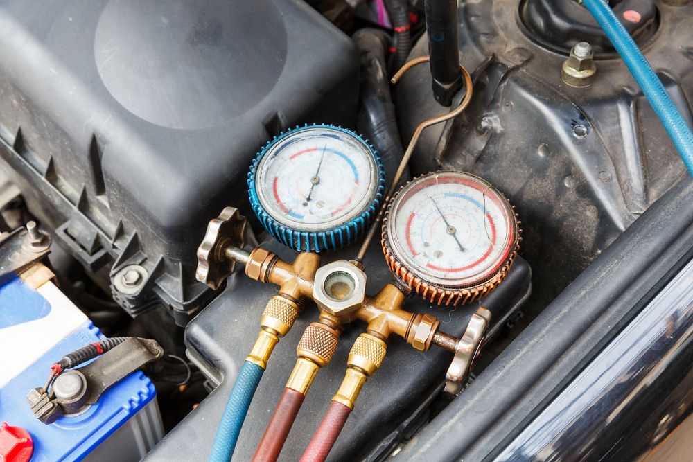 Two Gauges Are Sitting Under The Hood Of A Car — Gillies Enterprises Pty Ltd In Coonabarabran, NSW