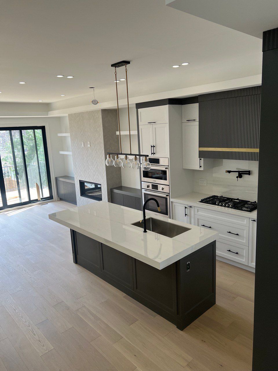 There is a large island in the middle of the kitchen.