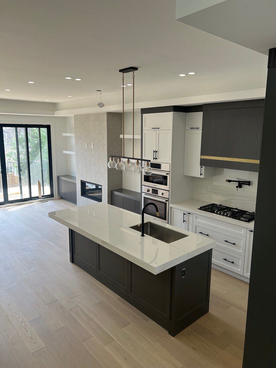 A kitchen with a large island in the middle of it
