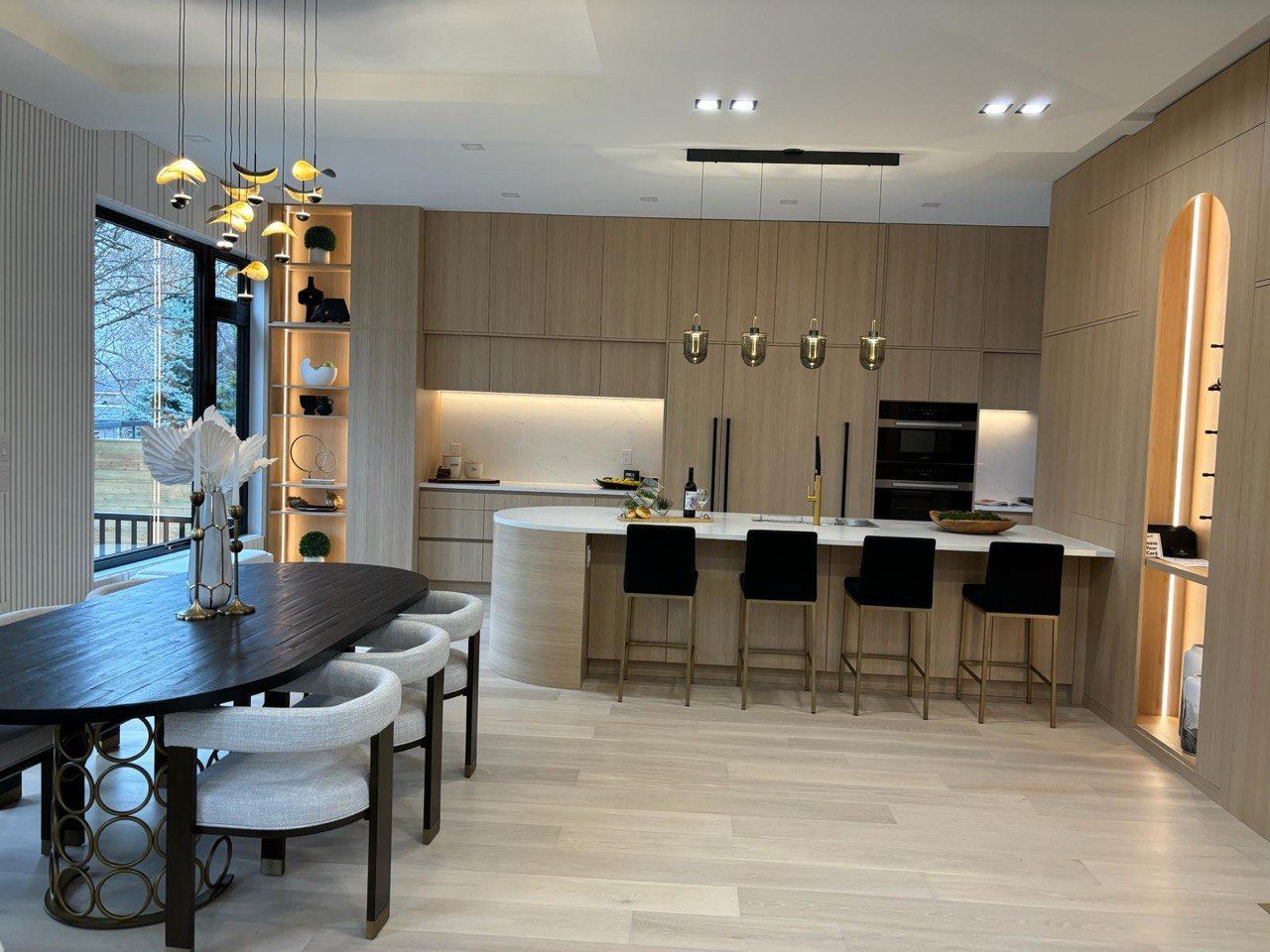 A kitchen with a table and chairs in it