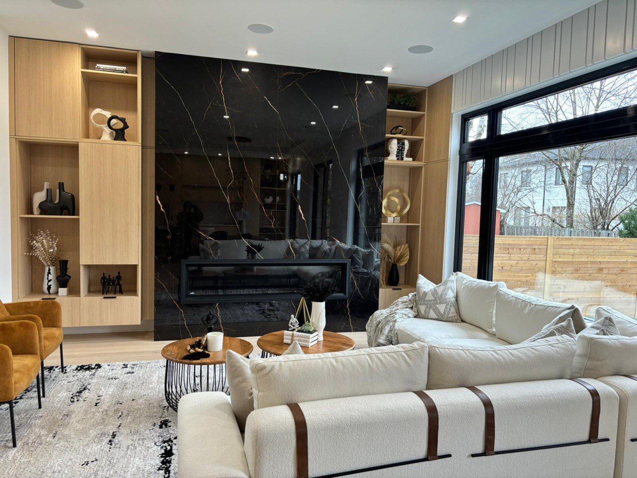 A living room filled with furniture and a fireplace.