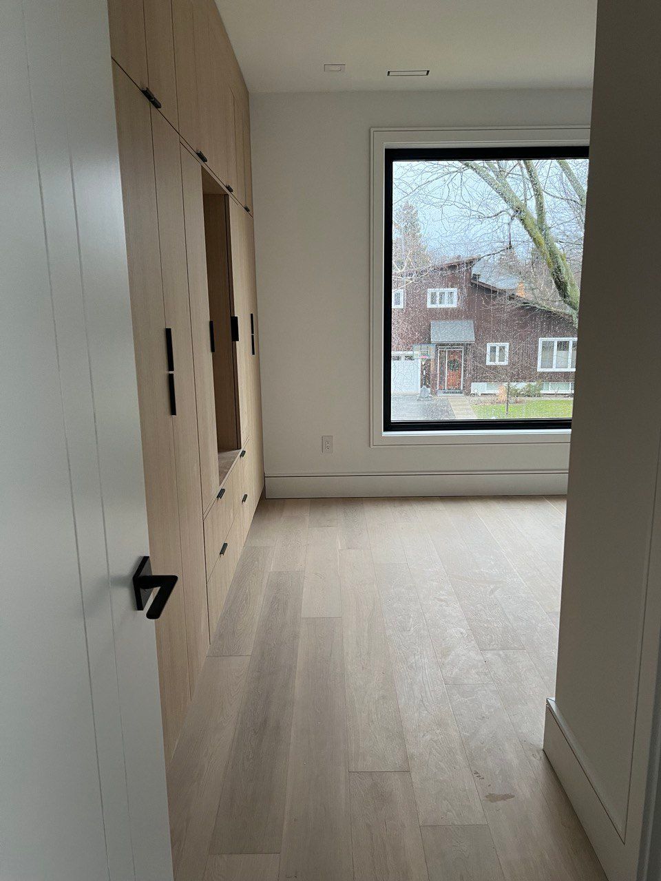 There is a large window in the middle of the room.