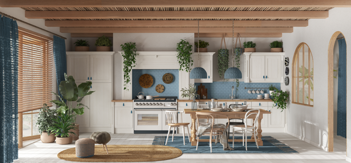Bright boho kitchen and dining area with blue cabinets, plants, and woven blinds