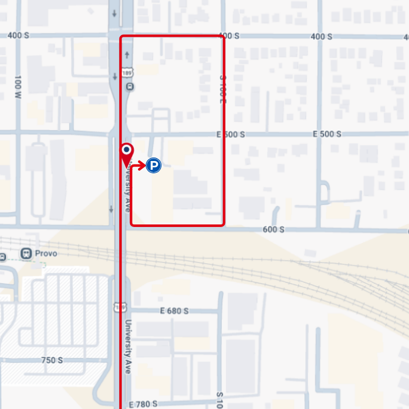 Map with a red highlighted route and a blue location marker near intersecting streets and a highway.