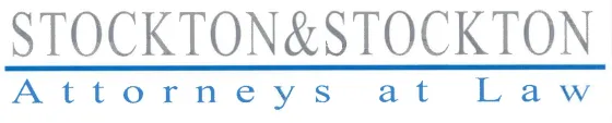 Logo for Stockton & Stockton, Attorneys at Law. Text in gray above a blue line, with the phrase 