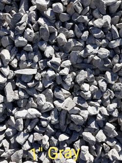Gray crushed gravel with rough, angular stones filling the frame