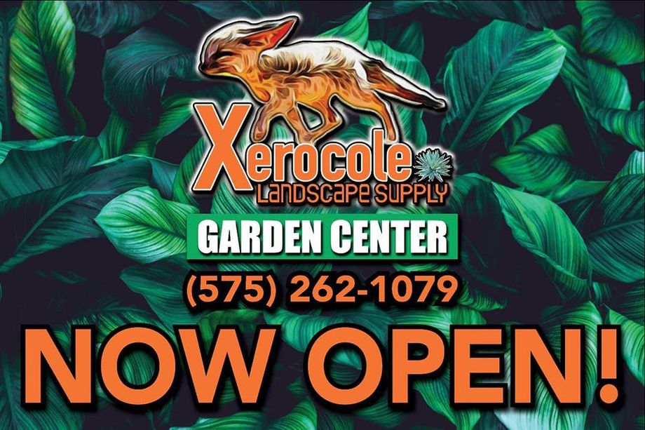 Xerocle garden center sign with green leaves, orange lizard logo, phone number, and “NOW OPEN!”