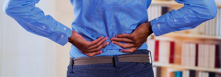 A Man With Back Pain — Lake Worth, FL — Total Injury Chiropractic A Man With Back Pain — Lake Worth, FL — Total Injury Chiropractic