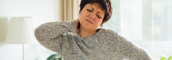 Woman Showing Pain On Neck — Lake Worth, FL — Total Injury Chiropractic Woman Showing Pain On Neck — Lake Worth, FL — Total Injury Chiropractic