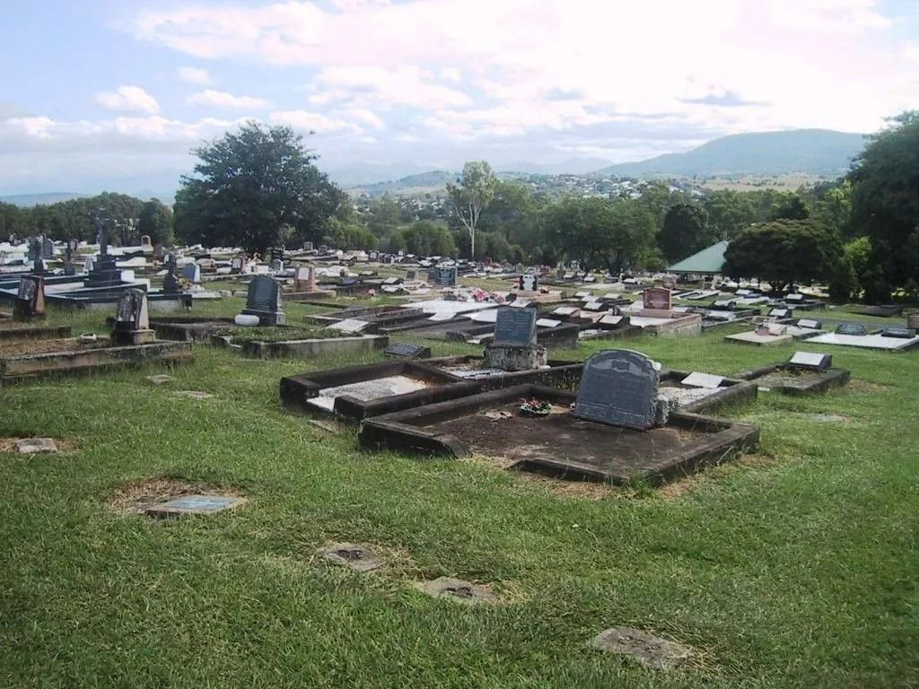 A cemetery with a lot of graves in it
