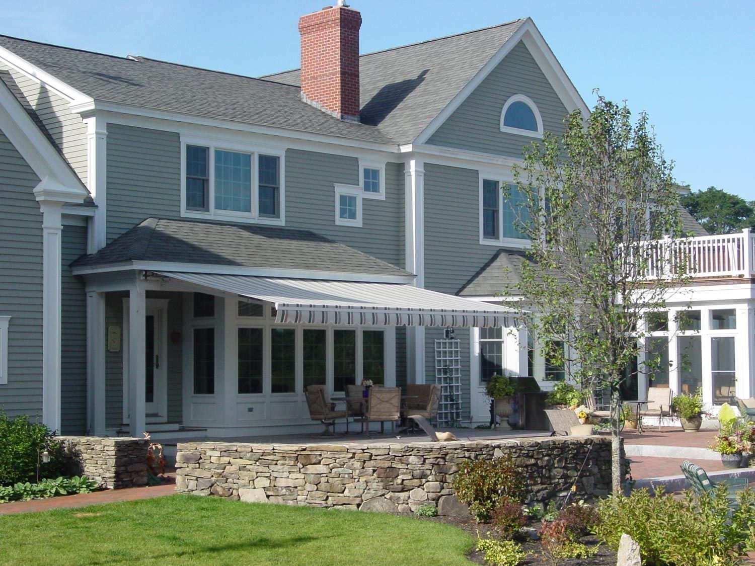 A large house with a large lawn in front of it