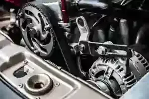 Close-up of a motorcycle engine with exposed gears and metallic components.