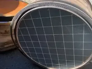 Two round solar panels with dark blue grid cells, one leaning against the other