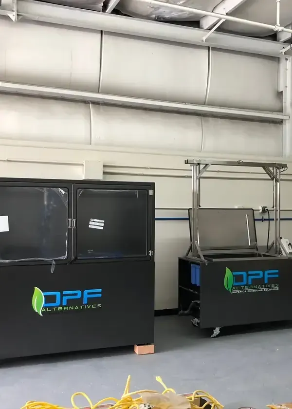 Two black DPF carts in a warehouse, one larger unit and one smaller cart with a canopy.