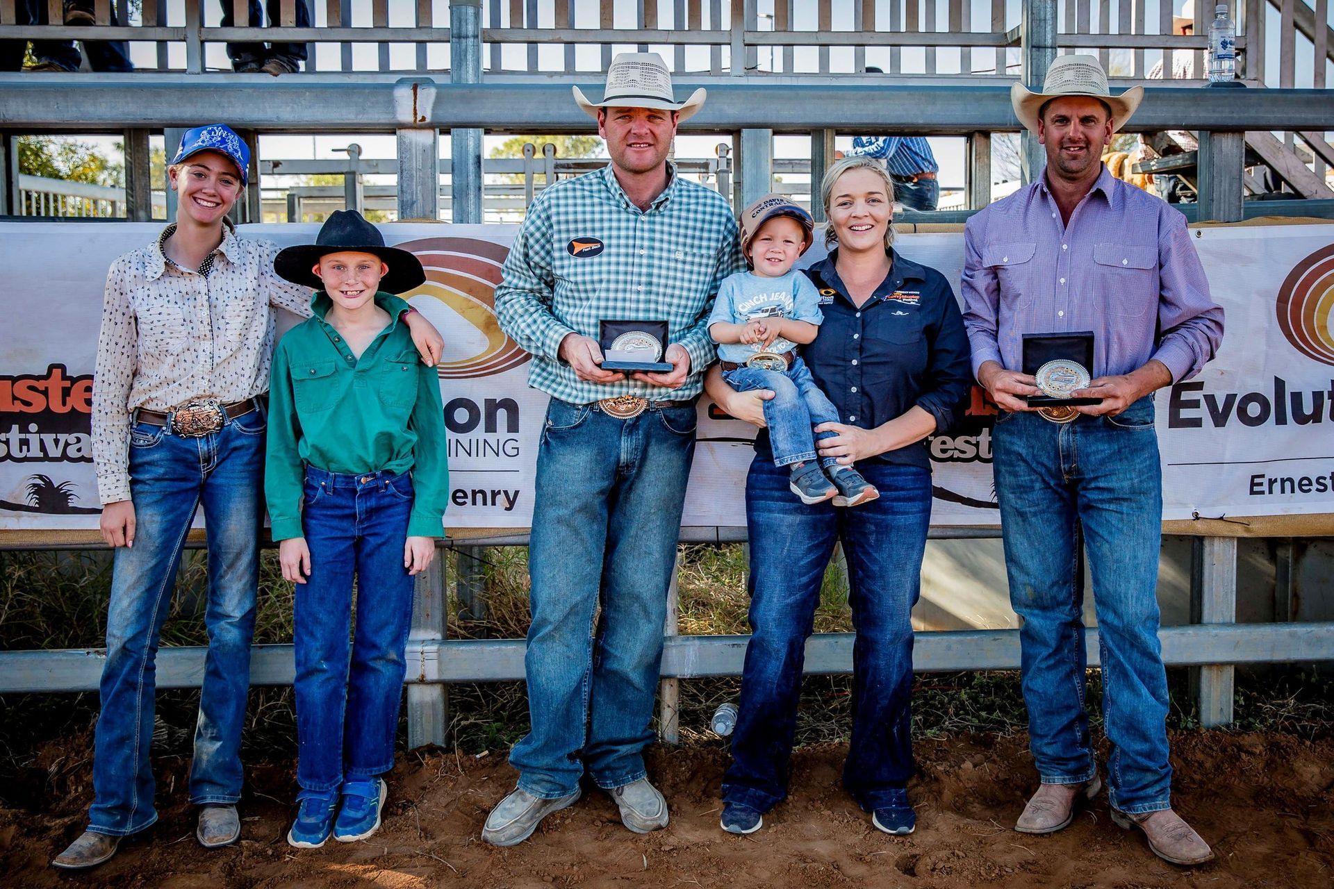 A Group of People Are Posing for a Picture — Outback Auctions and Real Estate in Cloncurry, QLD