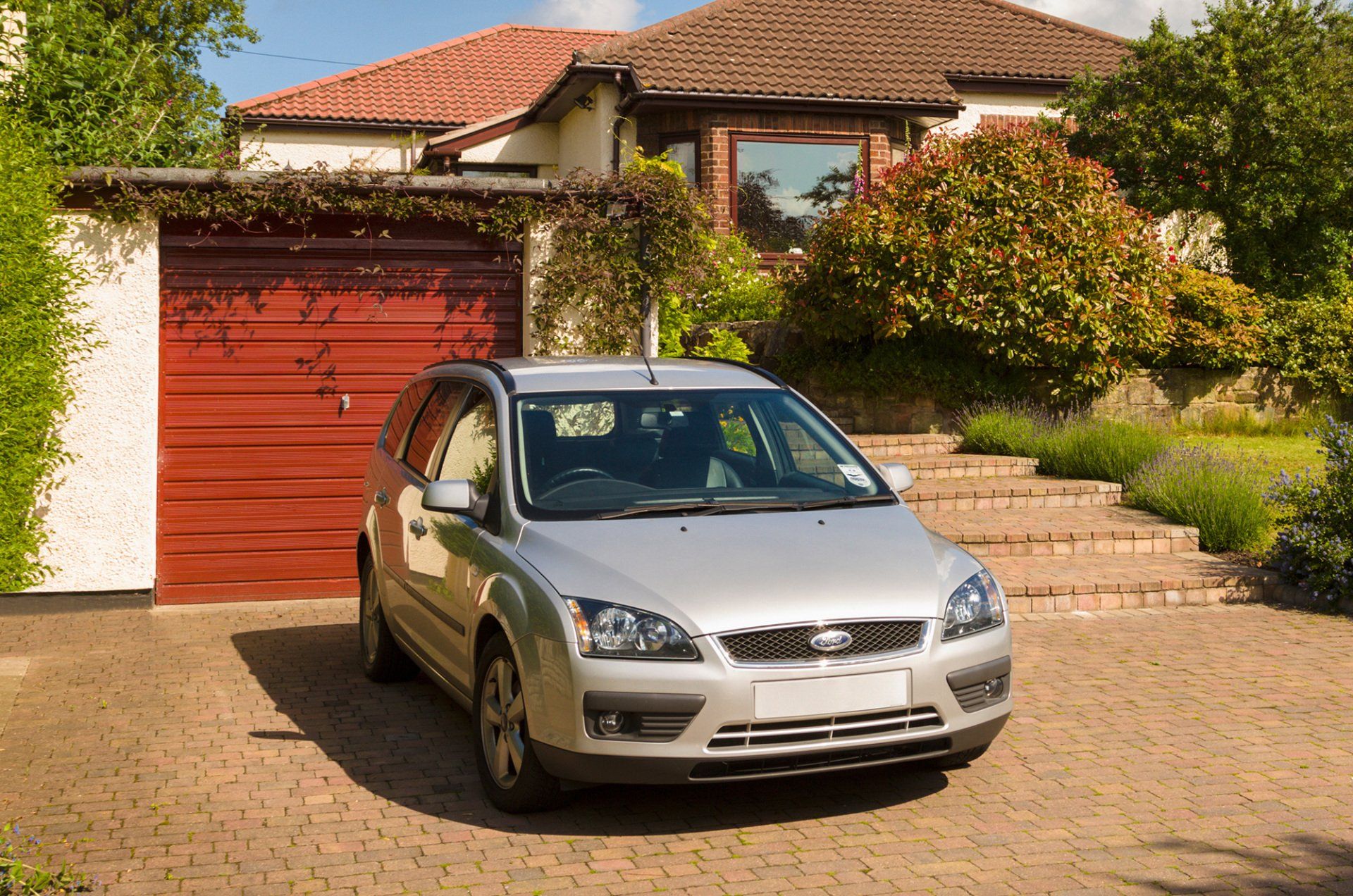 Bungalow driveway, garage and front garden