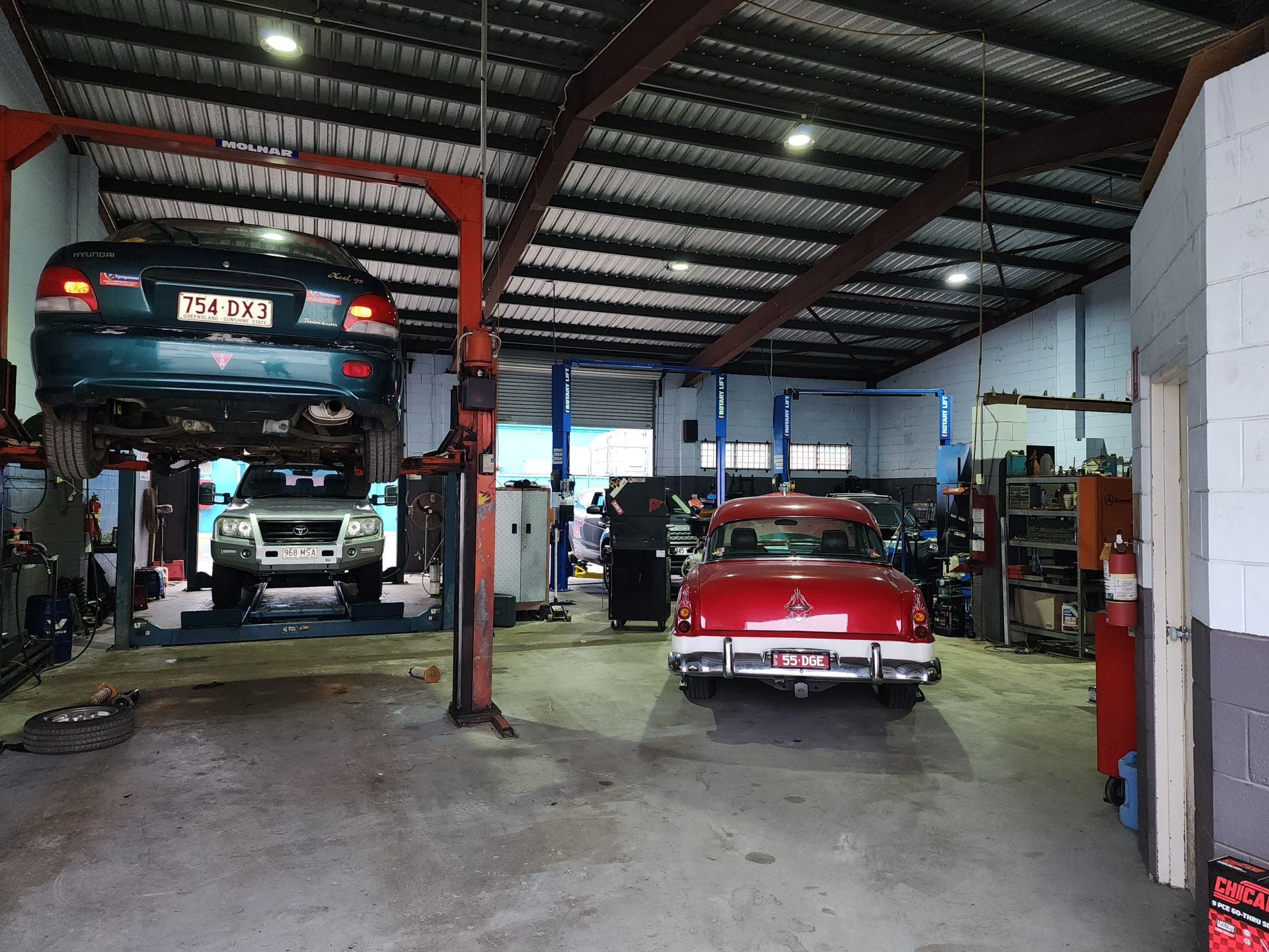 Mechanic in Uniform Using a Wrench — Total Auto Service In Caloundra West, QLD