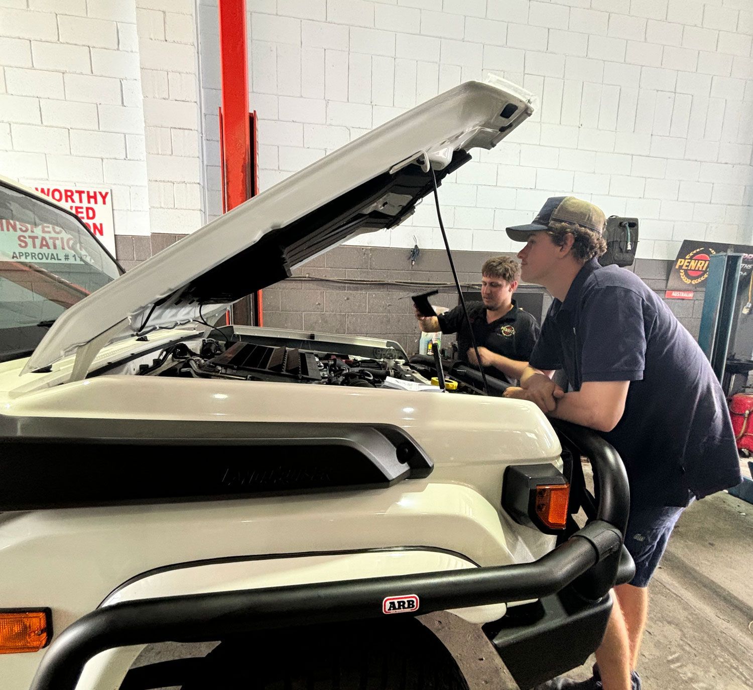 Mechanics In Caloundra Inspecting A Vehicle — Total Auto Service In Caloundra West, QLD