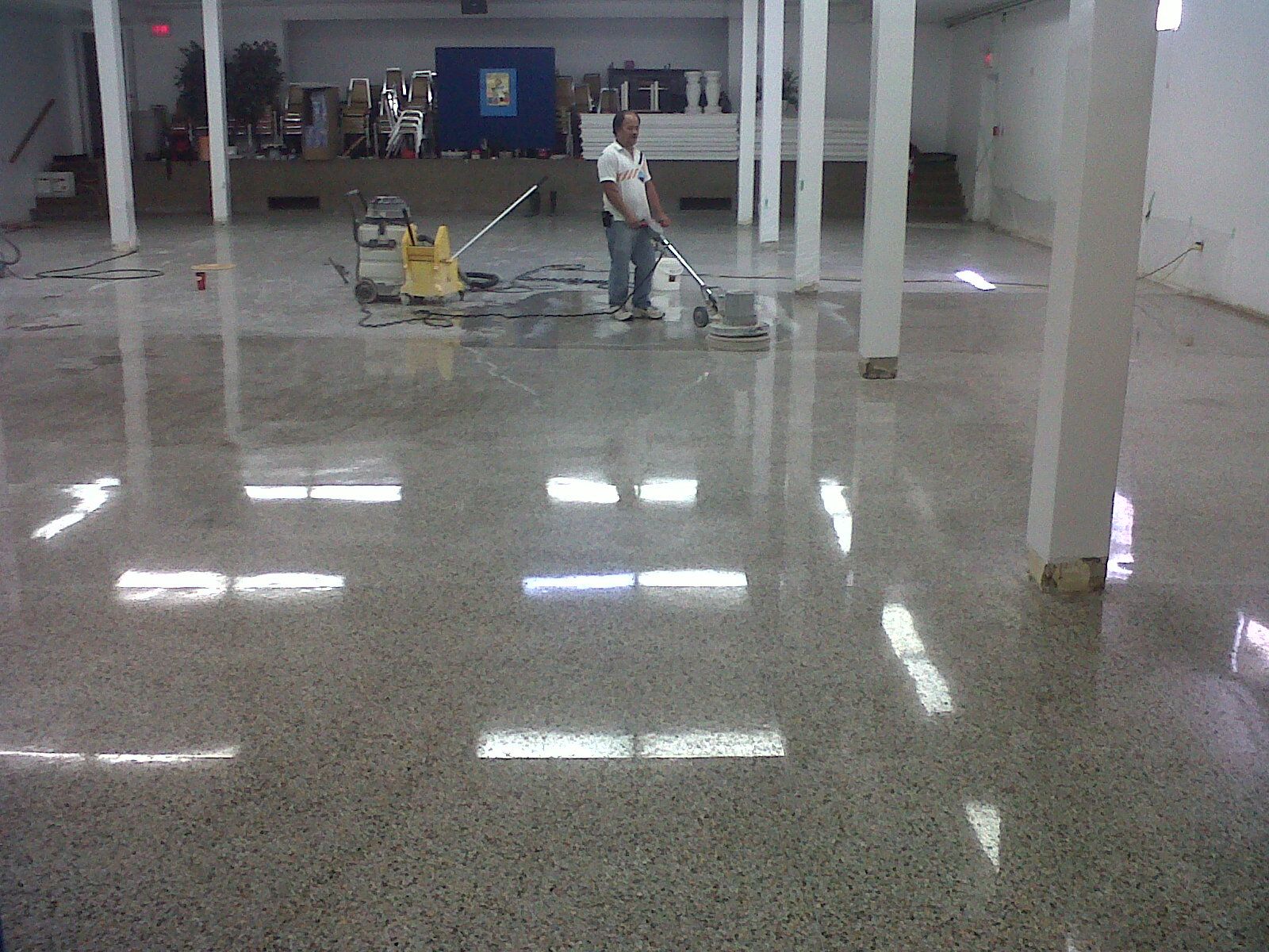 man polishing large commercial floor