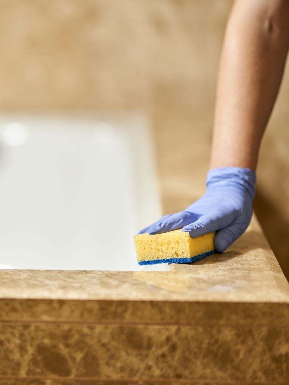 worker cleaning tile