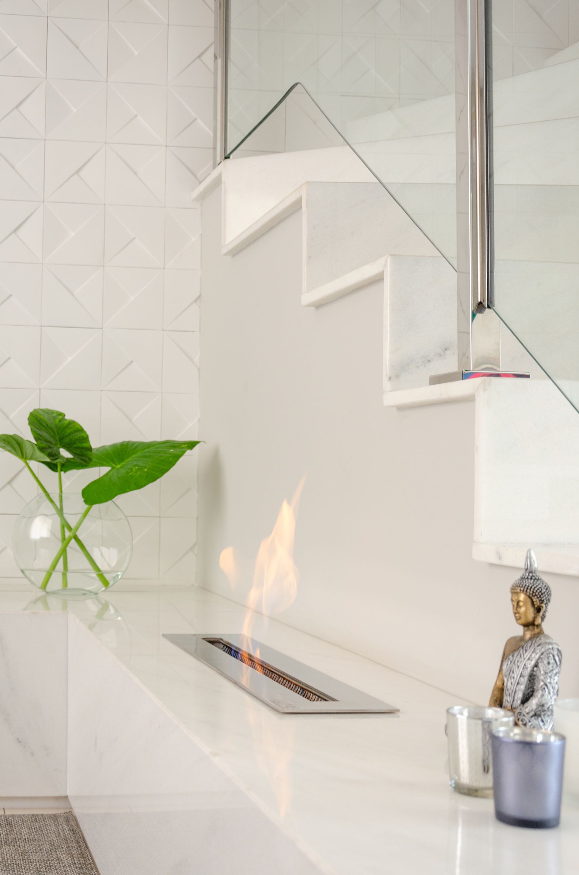 white shiny marble fireplace
