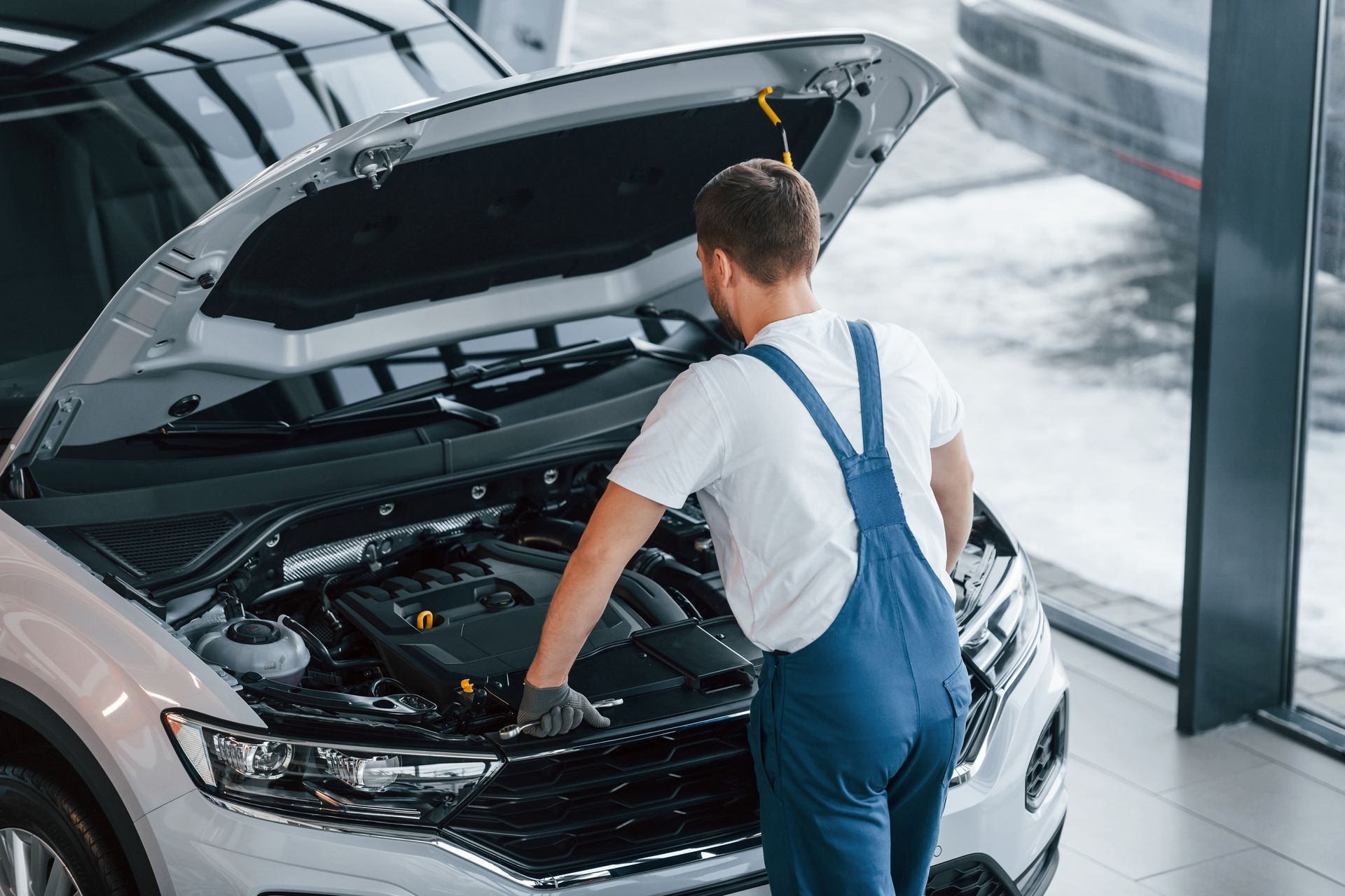 Man in a Car Repair Shop