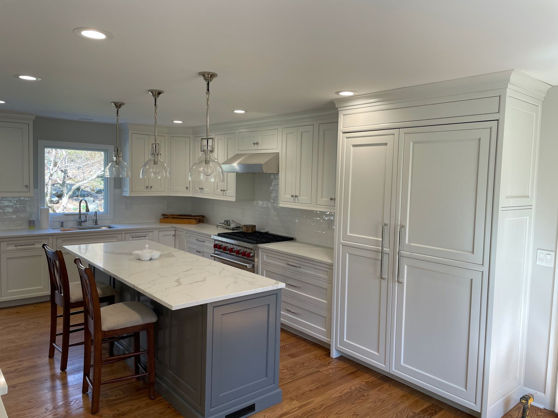 There is a large island in the middle of the kitchen.