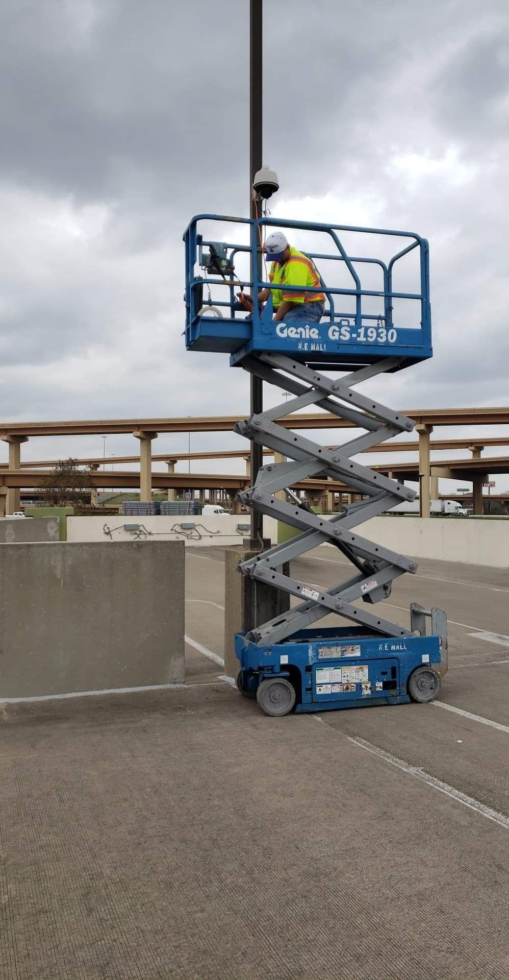 Technician reviewing access control panel and camera coverage plan