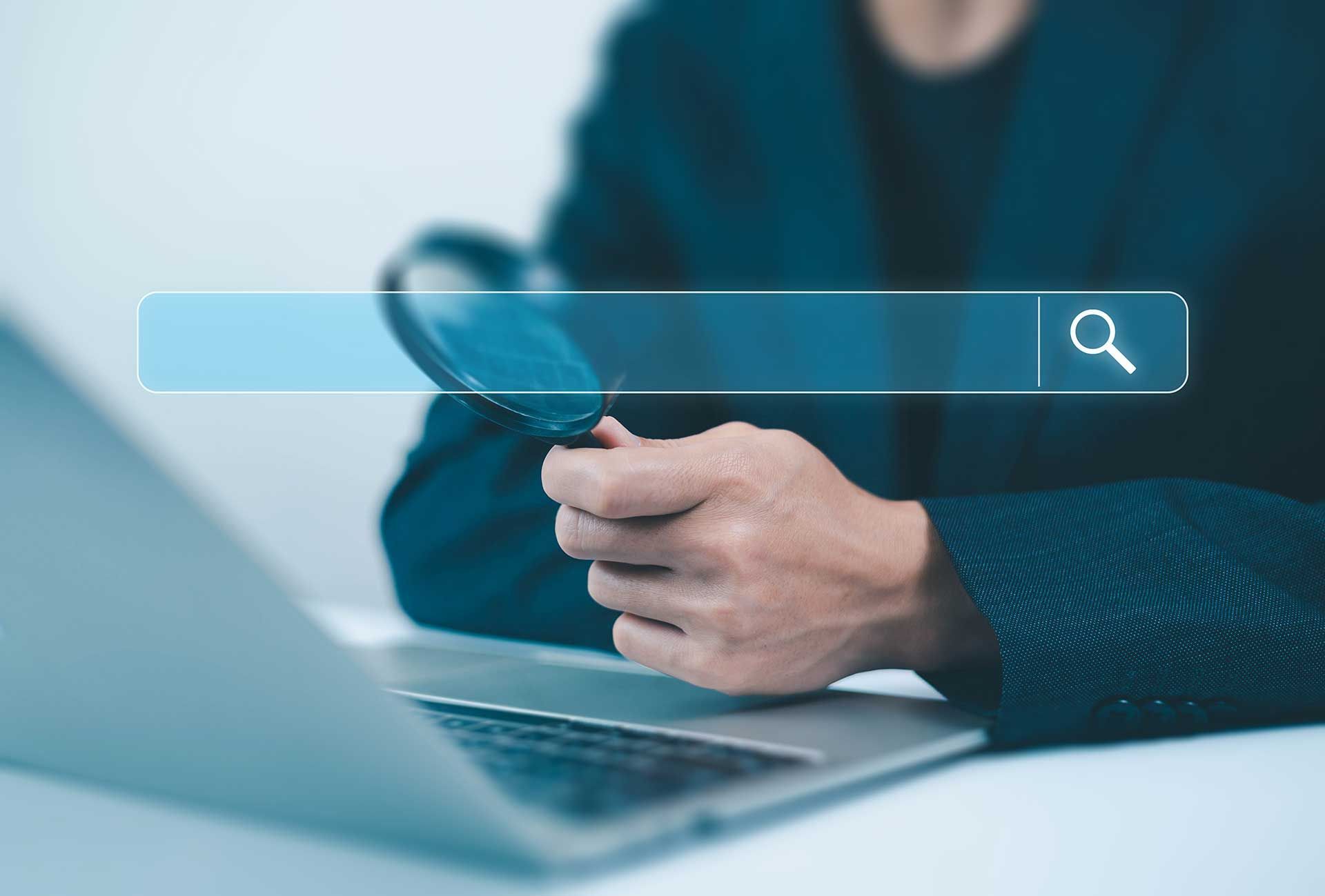 Private Investigator Sat Behind Laptop Computer