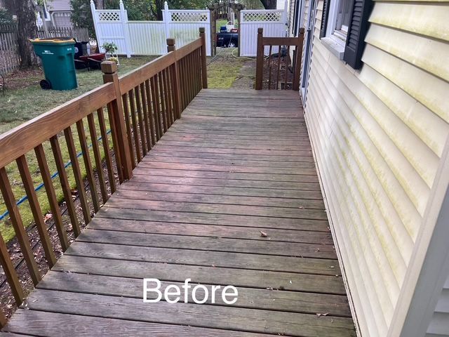 A before picture of a wooden deck next to a house.