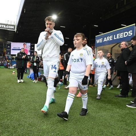 Daniel walking out at Elland Road with Leeds United centre back Joe Rodon