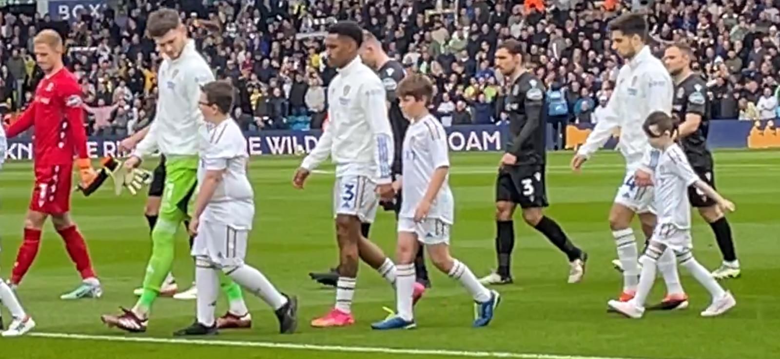 Sebastian walking out at Elland Road with Leeds United number 3, left back Junior Firpo