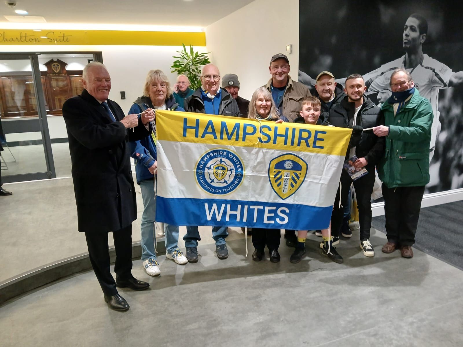 Hampshire Whites handing over cheque to a chosen charity