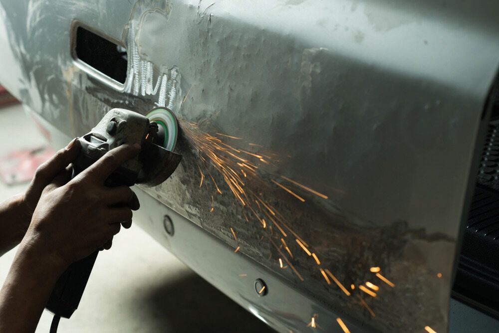 A Person is Polishing a Car With a Grinder — Seabreeze Auto Body in Coffs Harbour, NSW