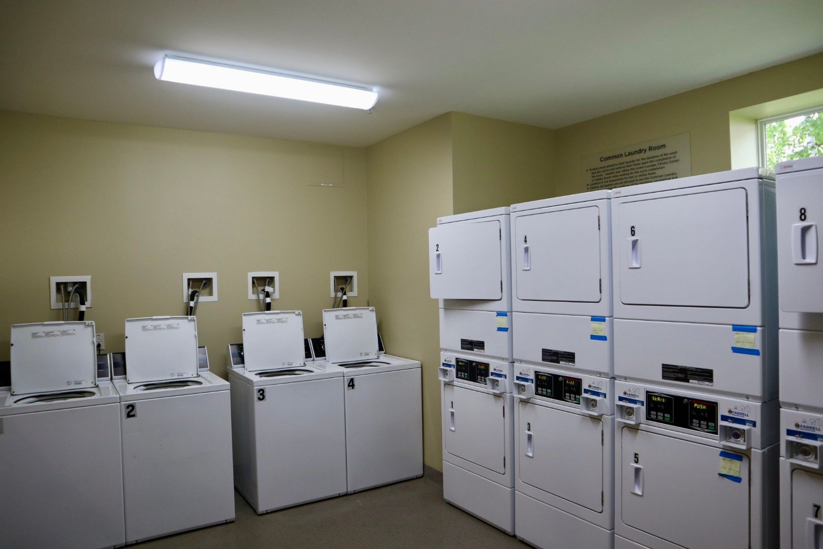 A laundromat with a lot of washers and dryers
