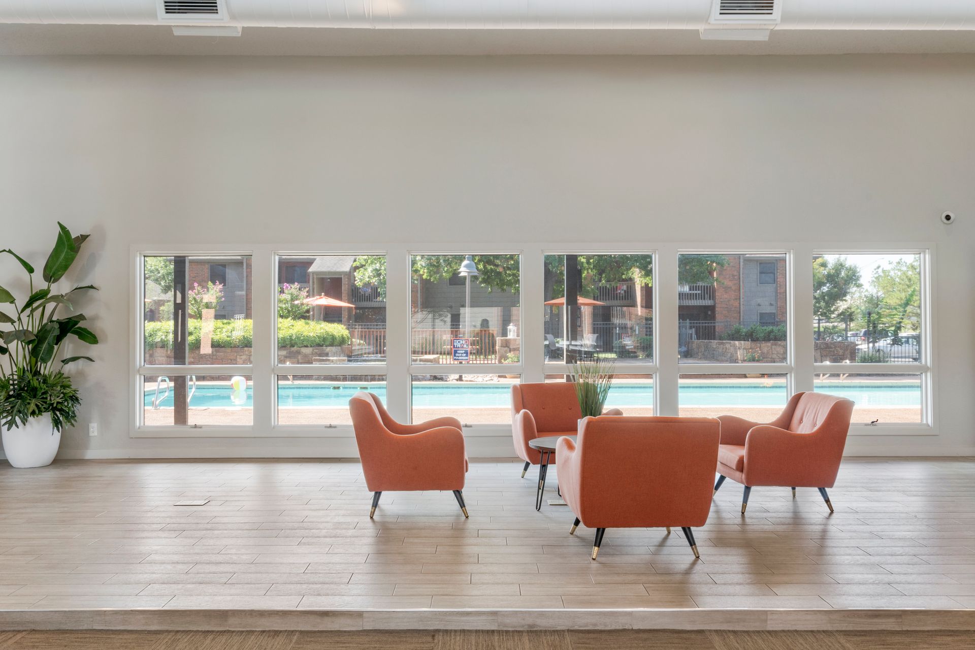 echo trail clubhouse lounge area with view of pool