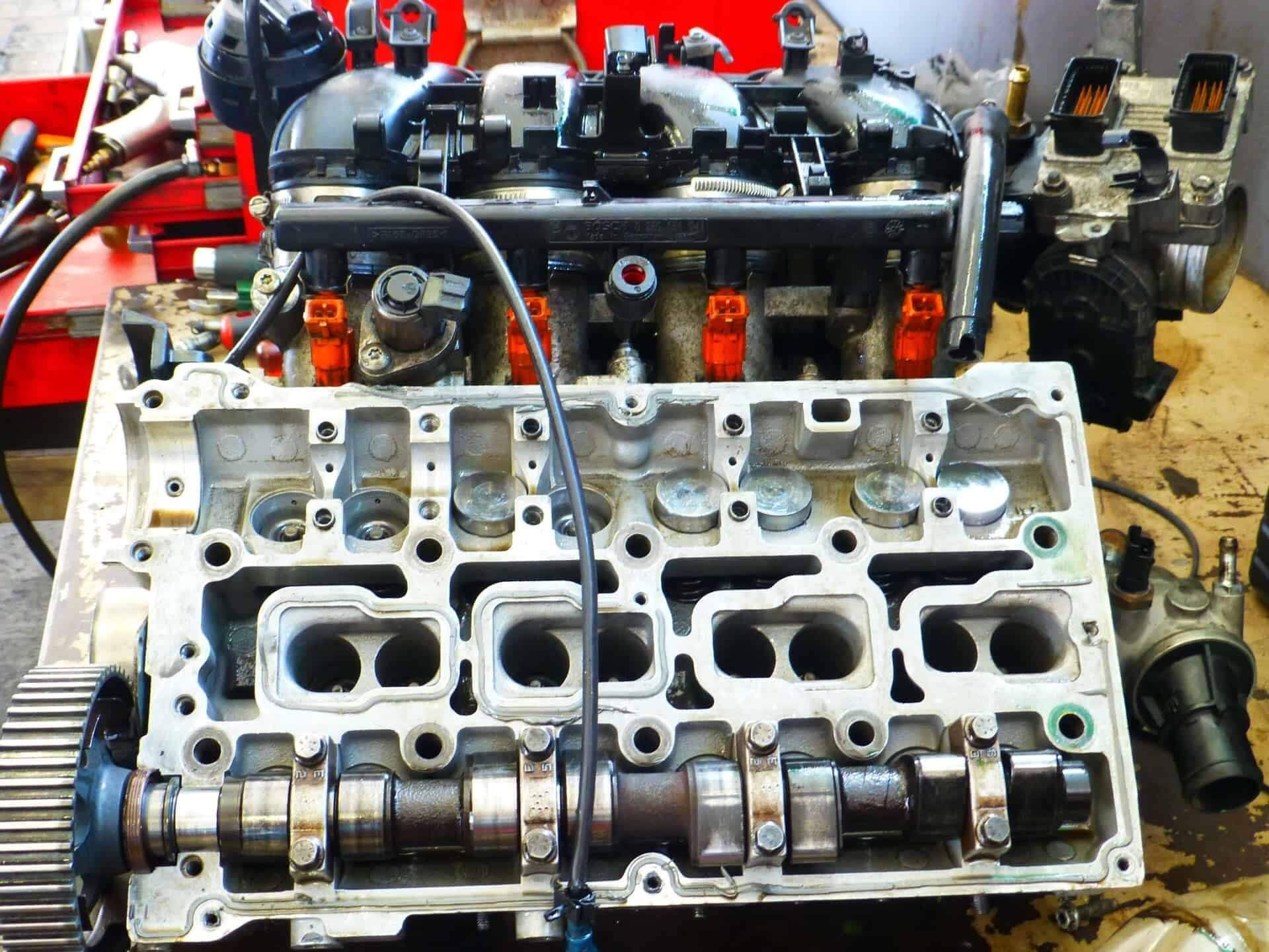 A car engine is being worked on in a garage | Doctor of Motors