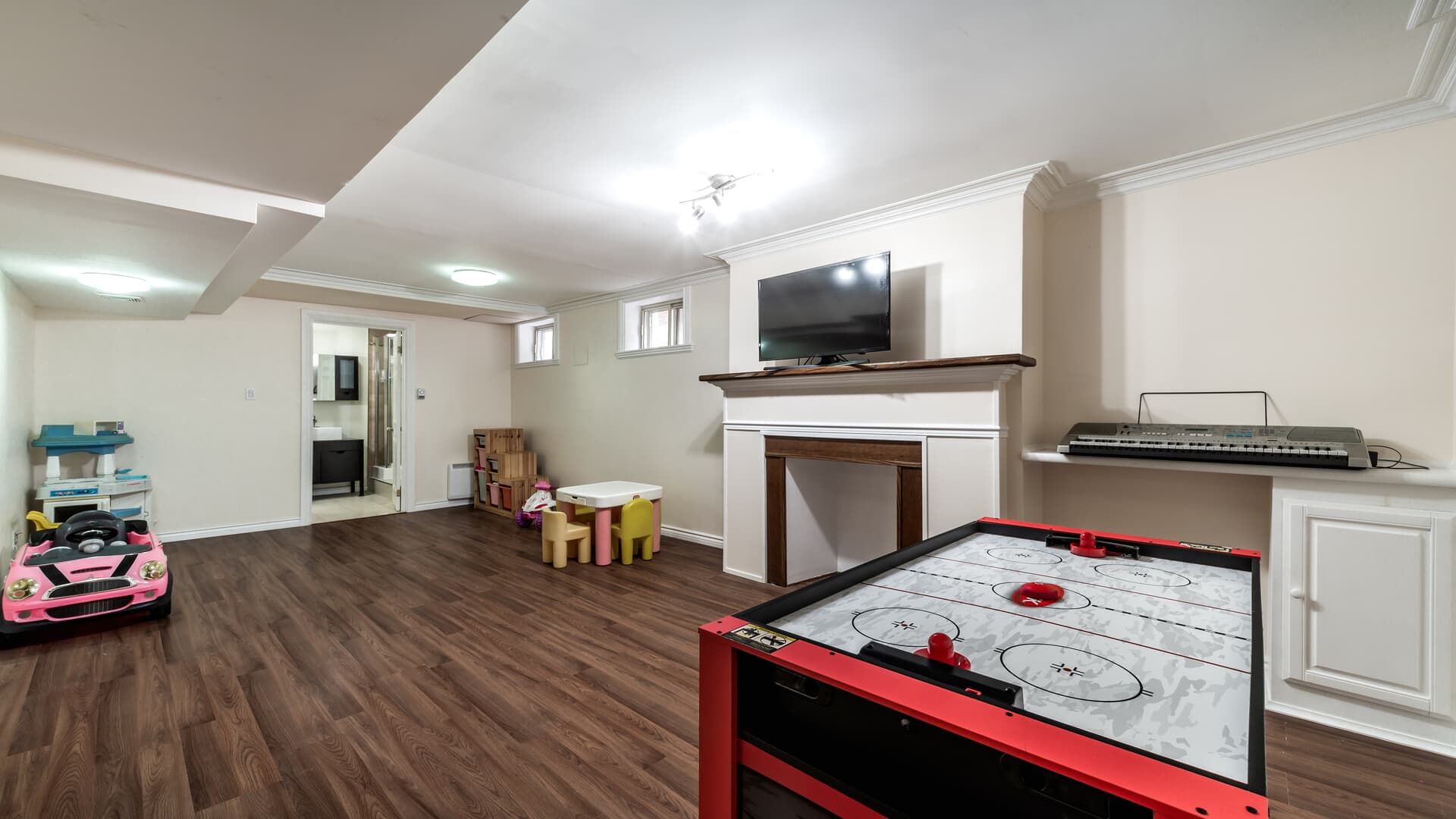 There is a game table in the middle of the room.