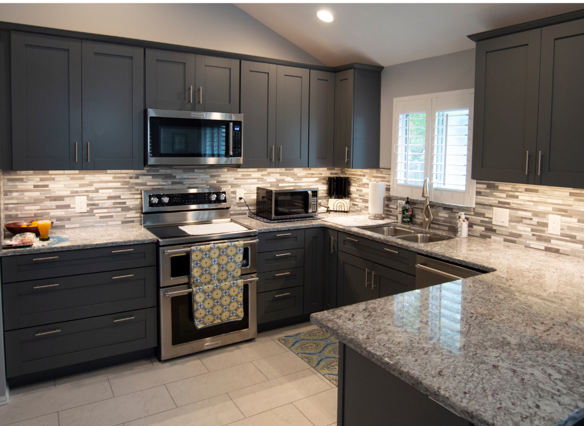 The inside of a moving truck filled with boxes and blankets.