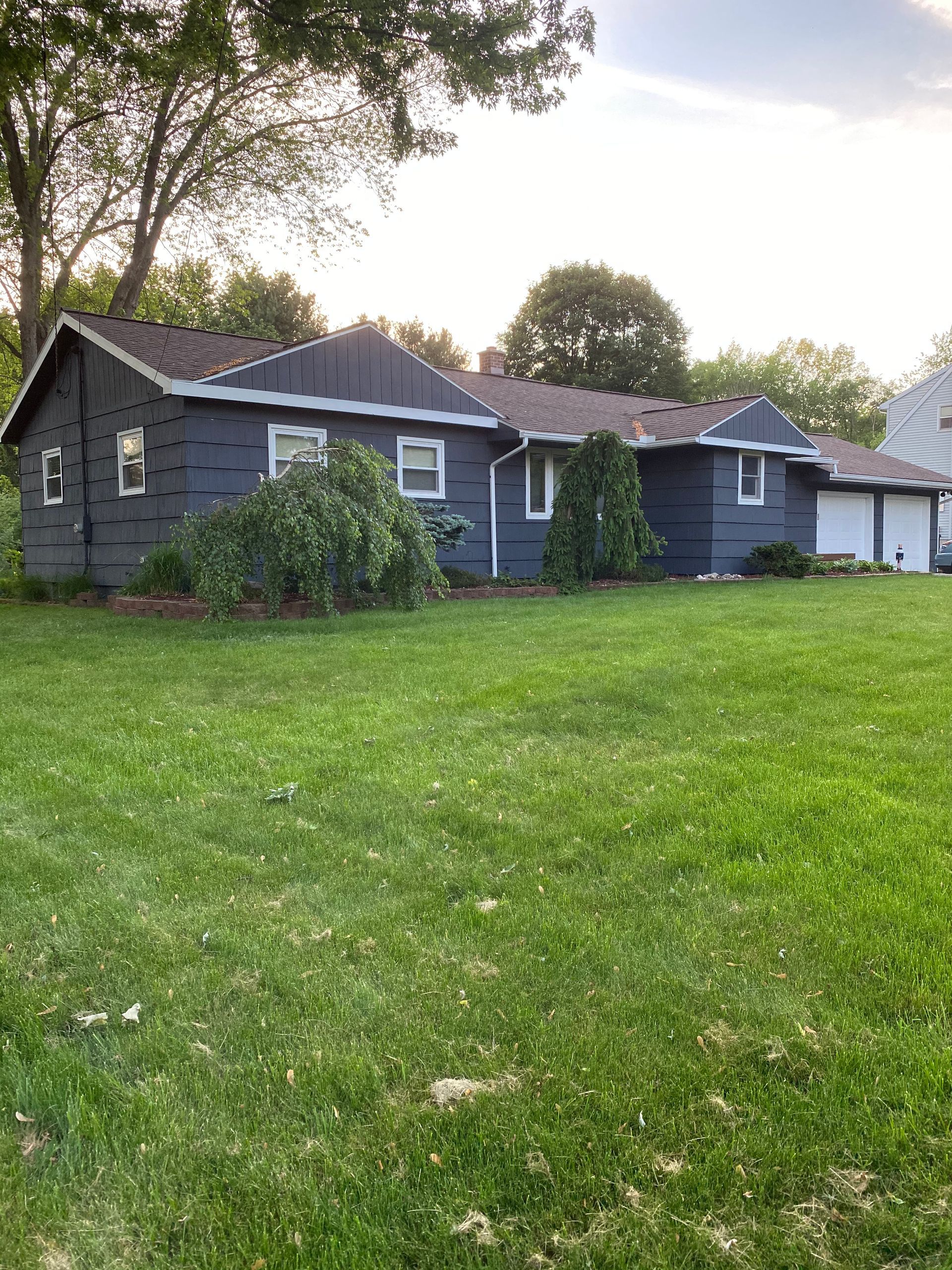 A large house with a lot of grass in front of it.